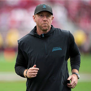 2025 Jacksonville Jaguars Black Half-Zip Vest modeled after Coach Liam Coen’s sideline gear with a modern fit.