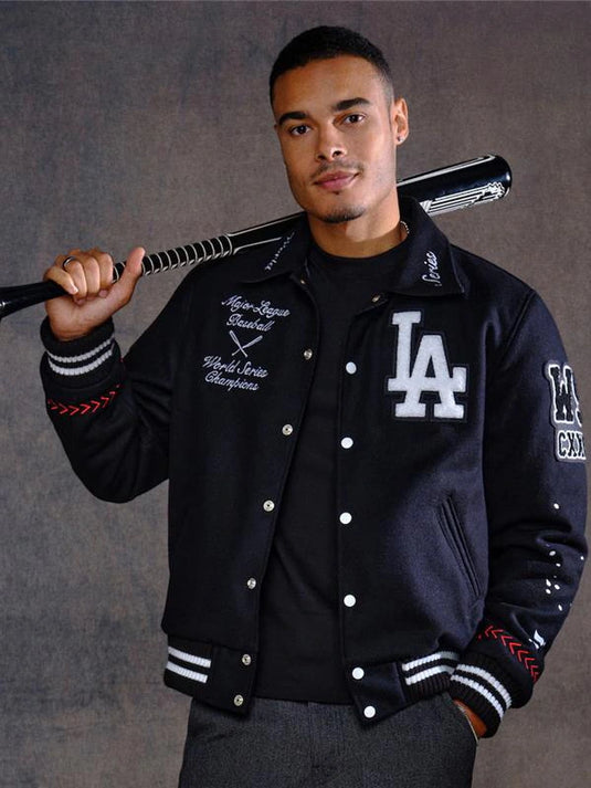 Los Angeles Dodgers Joshua Vides x Fanatics 2025 World Series Champions Black Varsity Jacket with full-snap closure.