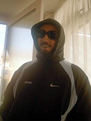 Black Palace Nike Air Max 95 2026 track jacket recreated with smooth fabric and modern zip-through styling