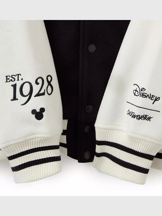RECREATED women’s Mickey Mouse jacket by Cakeworthy with black body, white sleeves, and standout varsity vibes
