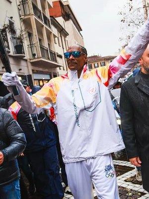 Recreated Milano Cortina 2026 Winter Olympics jacket in white, with full-zip closure and torchbearer-inspired design elements referencing Snoop Dogg.