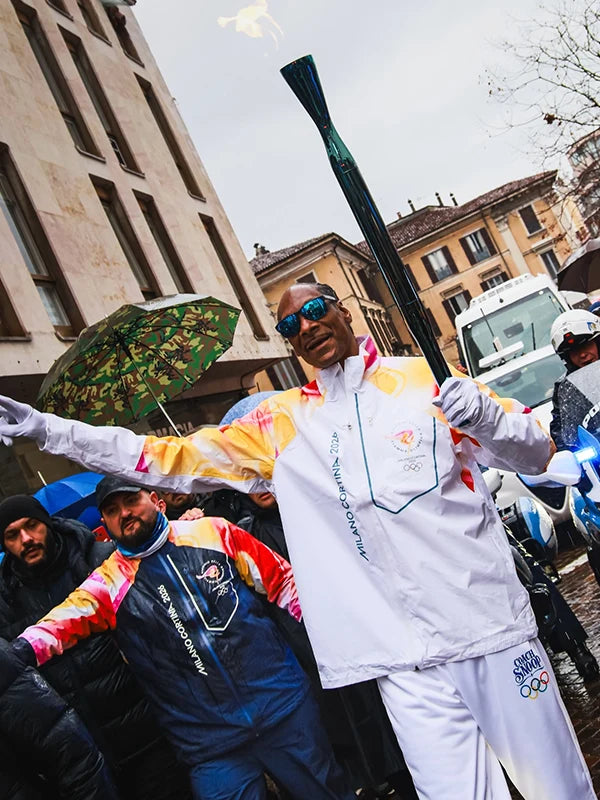 White full-zip jacket recreated with Milano Cortina 2026 Winter Olympics branding, designed in honor of Snoop Dogg carrying the Olympic torch.