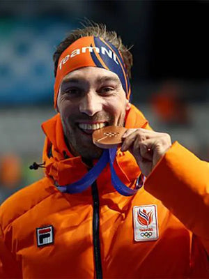 Orange Team Netherlands puffer jacket inspired by Kjeld Nuis at Milano Cortina 2026, quilted construction and athletic winter styling