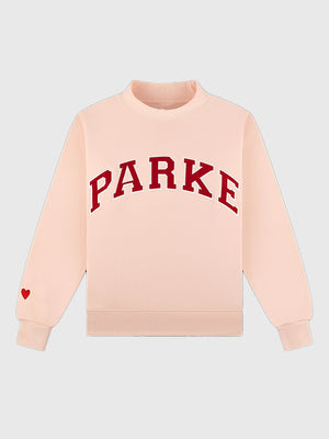 RECREATED Parke Valentine’s 2026 drop varsity mockneck fleece sweatshirt in light pink with a soft pastel tone