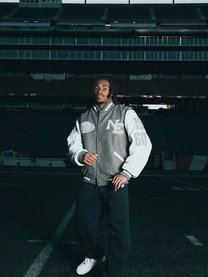 CNCPTS x Nike Patriots varsity jacket recreated with set-in sleeves and a refined grey and white color layout.