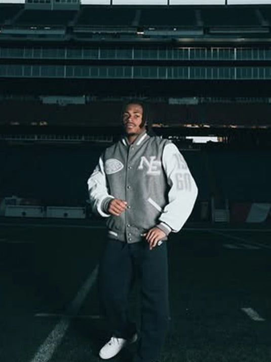 CNCPTS x Nike Patriots varsity jacket recreated with set-in sleeves and a refined grey and white color layout.