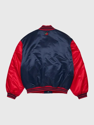 Denim Tears 2026 satin varsity jacket recreated in navy and red with sleek texture and statement outerwear appeal