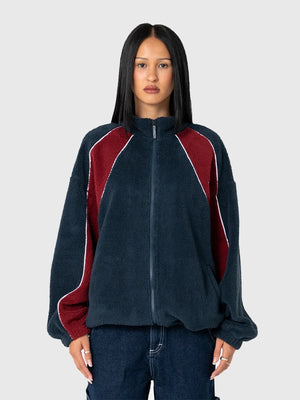 RECREATED Rusty 2026 Two Tides fleece jacket featuring sherpa texture, full zip closure, and relaxed unisex street-outdoor aesthetic