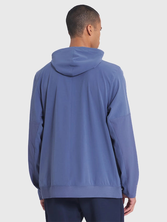 Blue Patriots sideline anorak from the 2025 Rivalries collection featuring a Nike half-zip build.