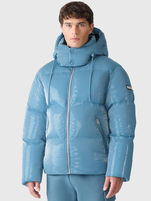 Recreated Andy Cohen NYE 2026 blue Mackage puffer jacket with removable hood and modern padded silhouette