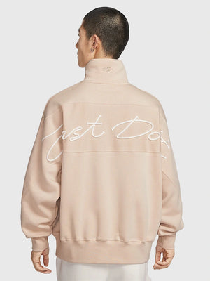 Nike limited edition fleece sweatshirt in light beige featuring quarter-zip closure and comfortable construction