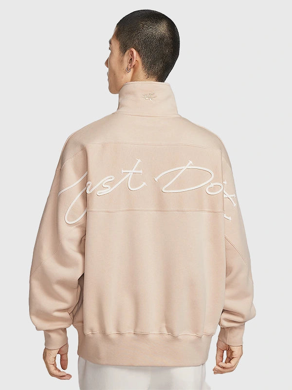 Nike limited edition fleece sweatshirt in light beige featuring quarter-zip closure and comfortable construction