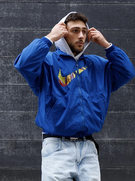 Recreated Nike FC Barcelona Essentials jacket in blue with lightweight construction and everyday fit