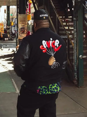 Nike Jae Tips Savior Destroyer Black Varsity Jacket showcasing a timeless varsity design with modern fashion-forward aesthetics