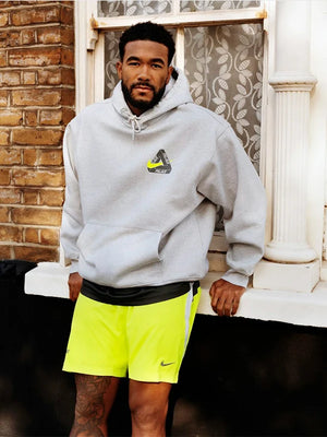 Palace x Nike Tri Swoosh pullover hoodie in light grey fleece for everyday wear and sleek co-branded appeal.