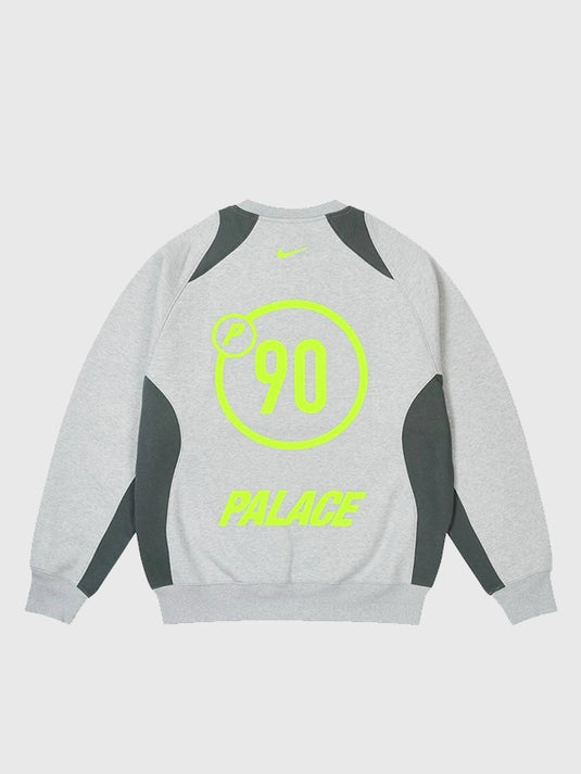 Light grey fleece Palace x Nike Total P90 crewneck offering a relaxed fit and signature co-branded detailing.