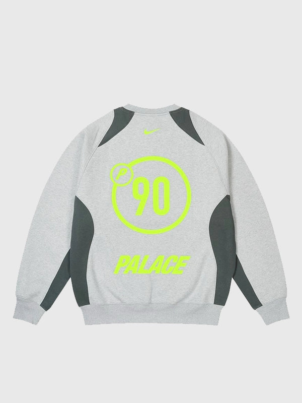 Light grey fleece Palace x Nike Total P90 crewneck offering a relaxed fit and signature co-branded detailing.