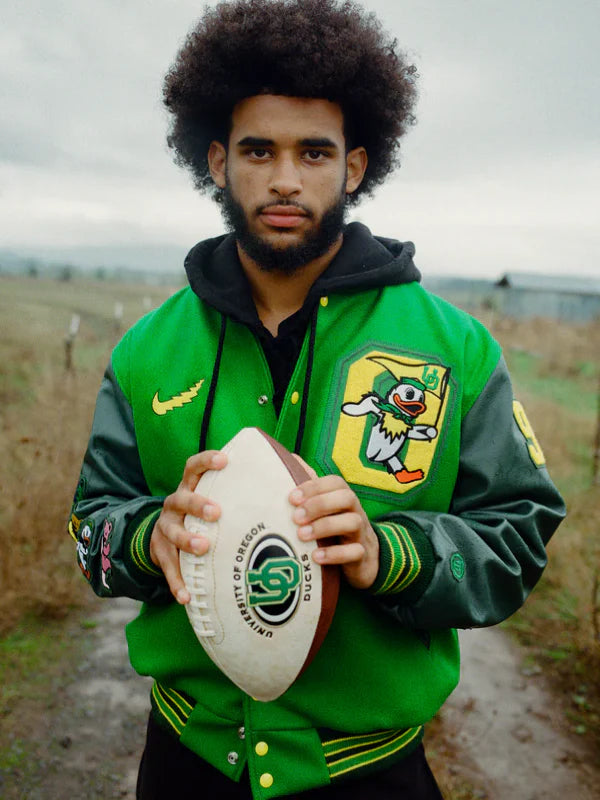 Recreated Nike Oregon Grateful Ducks varsity jacket in green with lettermen-style design.
