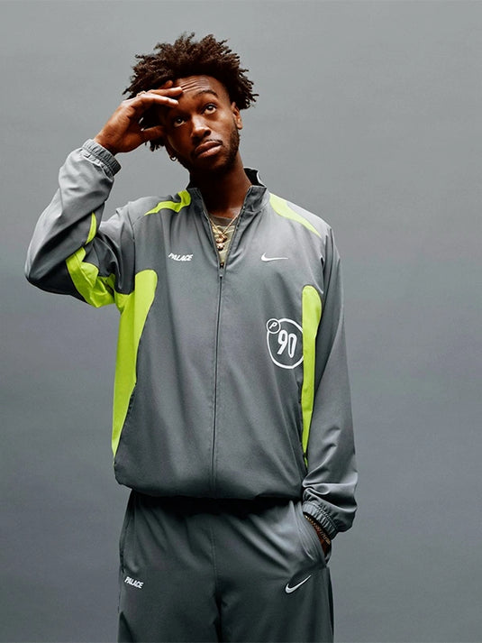 Nike x Palace 2025 grey Total P90 track jacket made with smooth athletic performance fabric.