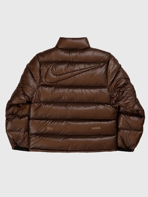 2025 Nocta x Nike Sunset puffer jacket in brown designed with soft down fill and modern streetwear flair.