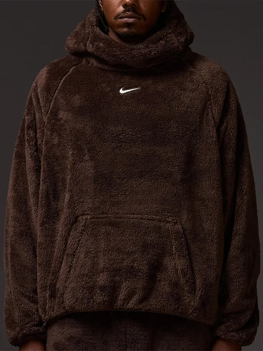 Unisex Nocta x Nike Chalet Polar Faux Fur Hoodie in brown with a plush fleece exterior and cozy relaxed fit.