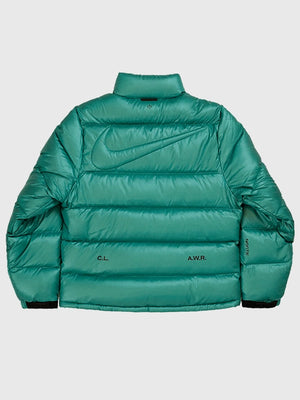 Recreated green Nocta x Nike puffer down jacket delivering lightweight insulation and a versatile unisex look.


