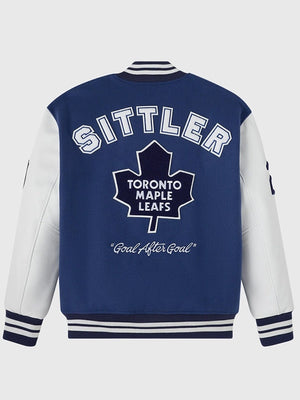 Blue wool varsity jacket with leather sleeves recreated in OVO Toronto Maple Leafs 2026 Darryl Sittler style