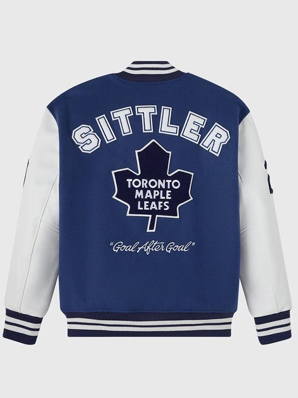 Blue wool varsity jacket with leather sleeves recreated in OVO Toronto Maple Leafs 2026 Darryl Sittler style