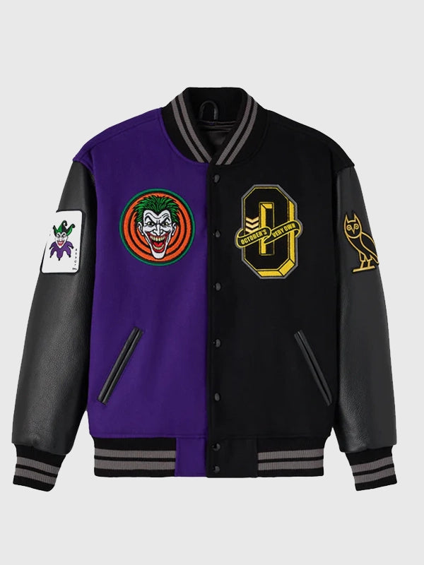 RECREATED October’s Very Own 2026 Batman x Joker Black & Purple Split Varsity Jacket designed with a structured collegiate fit and striking dual-theme aesthetics