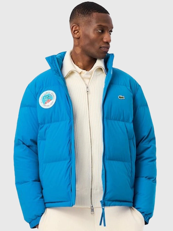 Men’s blue full-zip puffer jacket inspired by Lacoste x Olympic Heritage Cortina d’Ampezzo 1956 collection
