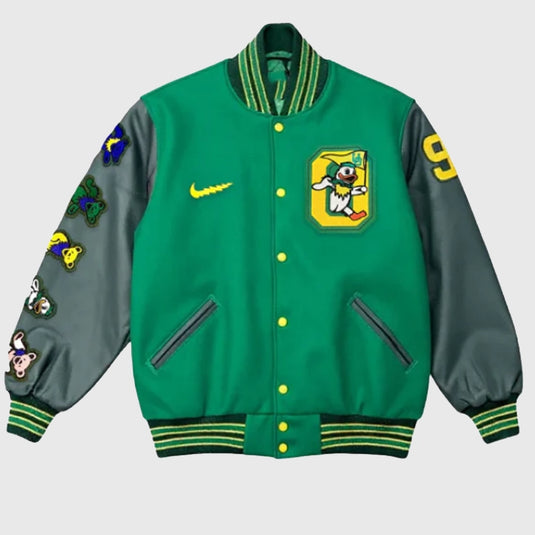 Green and gray varsity jacket with colorful designs and multiple logo patches