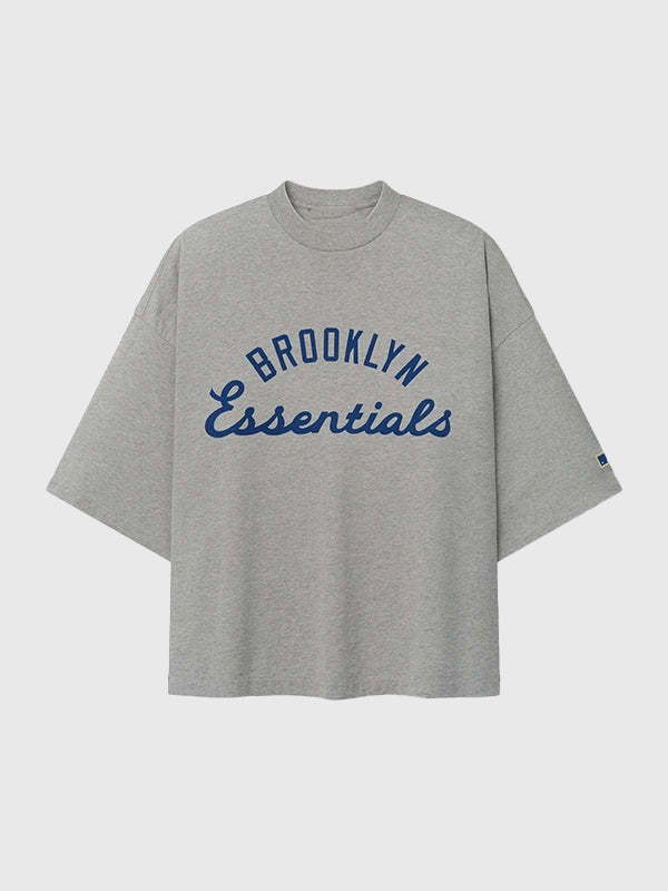 Essentials Fear of God Jackie Robinson Day Grey Oversized T-Shirt showcasing subtle graphic detailing and modern streetwear appeal

