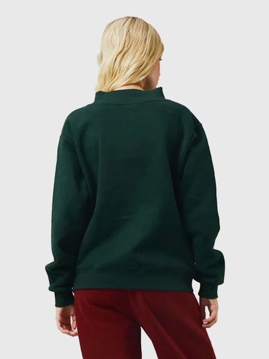 Green varsity fleece mockneck from the 2025 Recreation Parke Holiday collection showcasing a soft interior and clean finishes.