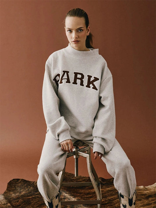 Recreated Parke Texas Varsity Mockneck Fleece Sweatshirt in grey with classic collegiate design.