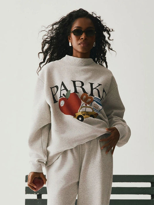 Parke New York fleece sweatshirt in grey designed with a mockneck and stylish graphic detailing.