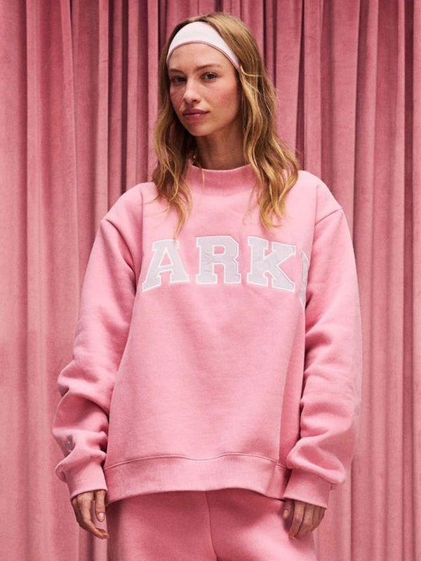 Dark pink RECREATED Parke Valentine’s 2026 varsity mockneck sweatshirt crafted from cozy fleece fabric