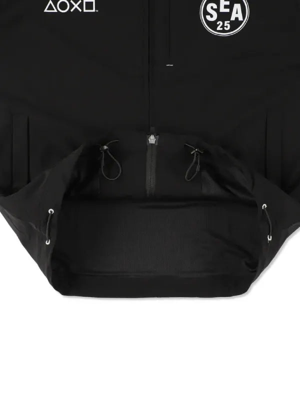 Recreated crossover tech jacket in black reflecting PlayStation branding and Wind and Sea streetwear influence