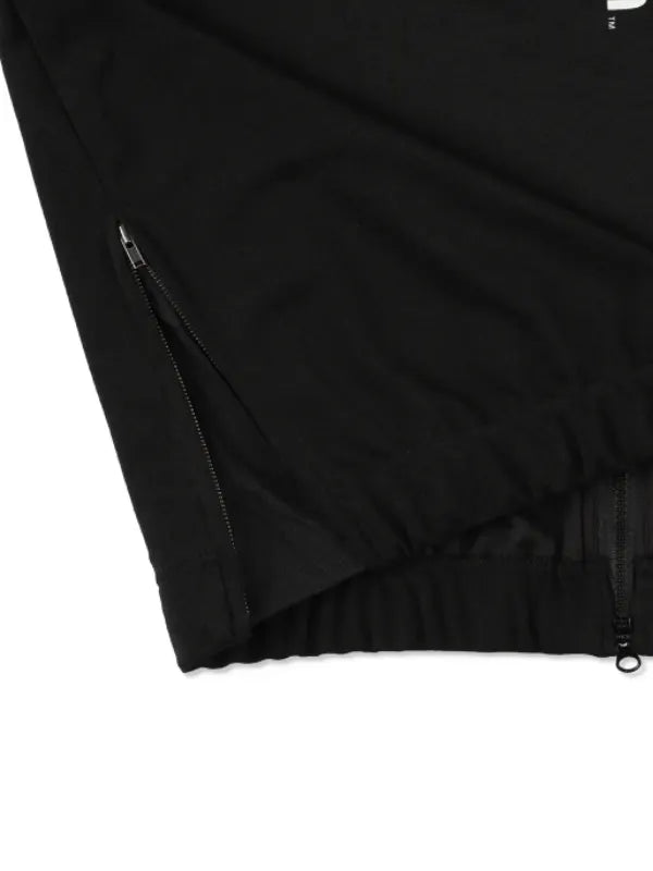 Recreated crossover track jacket in black reflecting PlayStation branding and Wind and Sea streetwear influence