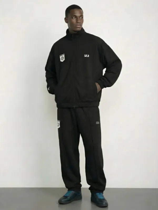 Black track jacket recreation combining PlayStation design cues with Wind and Sea modern appeal