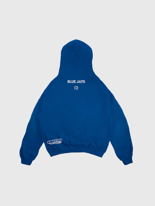 Blue fleece hoodie from the Blue Jays and The Weeknd 2025 World Series collaboration with legacy-inspired details.