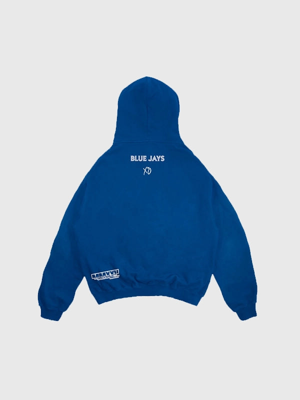 Blue fleece hoodie from the Blue Jays and The Weeknd 2025 World Series collaboration with legacy-inspired details.