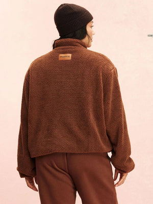 Parke 2026 quarter zip fleece pullover sweatshirt in brown with a warm tone and refined casual aesthetic