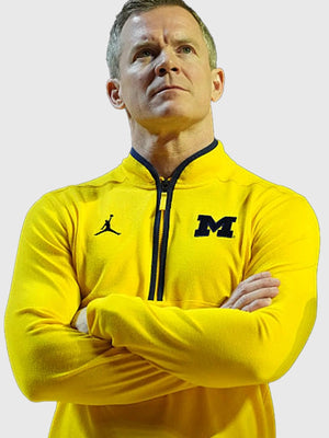 Michigan Wolverines Victory quarter-zip jacket recreated in yellow with breathable feel and everyday training appeal
