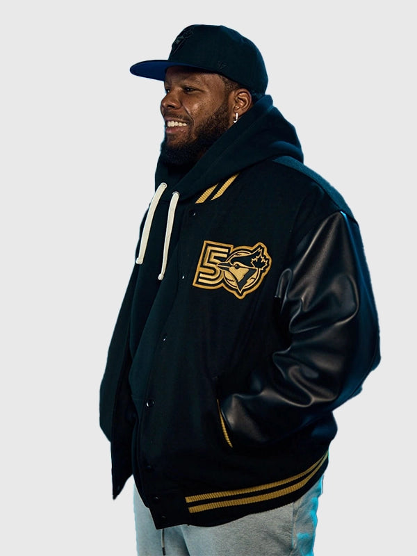 RECREATED Roots Toronto Blue Jays 50th Anniversary Merch Black Varsity Jacket showcasing a classic collegiate profile with commemorative team appeal