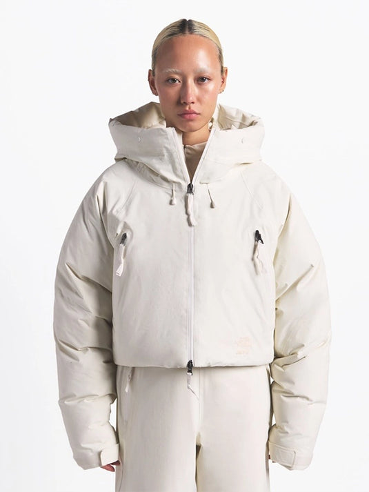 Recreated black and off-white insulated puffer jacket from The North Face x SKIMS designed for warmth and style