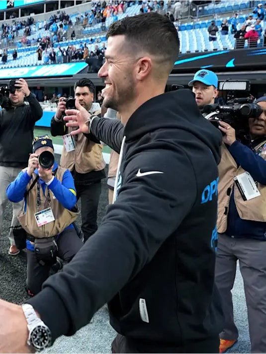 Nike black Inspire Change 2025 sideline pullover hoodie for the Carolina Panthers with Opportunity Equity Freedom Justice messaging