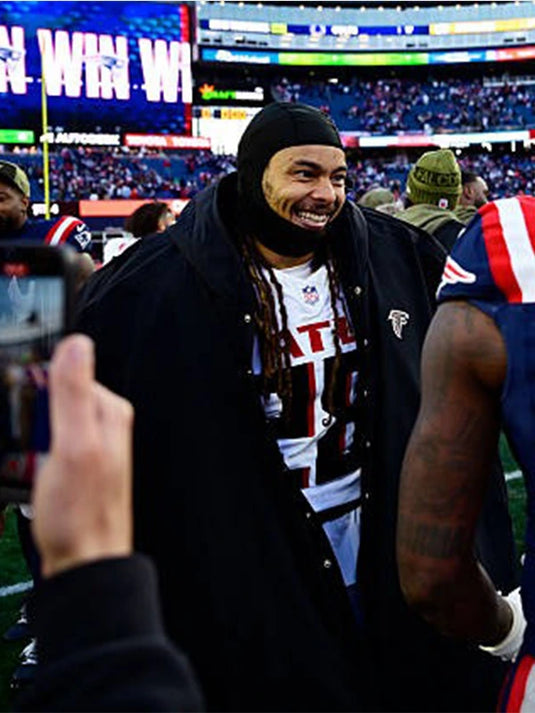 Stefon Diggs Atlanta Falcons Sideline Black Cape Coat featuring sleek design and relaxed drape.