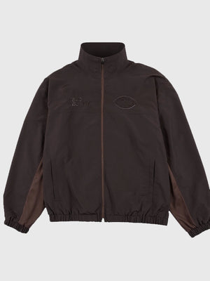 Super Tazón LX Bad Bunny brown unisex track jacket with full zipper and Spanish-inspired logo prints celebrating the 2026 halftime show
