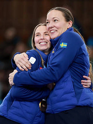 Recreated Winter Olympics 2026 Uniqlo Team Sweden blue padded jacket with smooth outer finish and zip closure