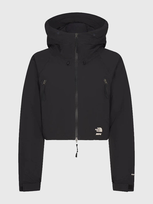 Recreation of the women’s The North Face x SKIMS 2025 insulated puffer jacket in black and off-white with a sleek padded design